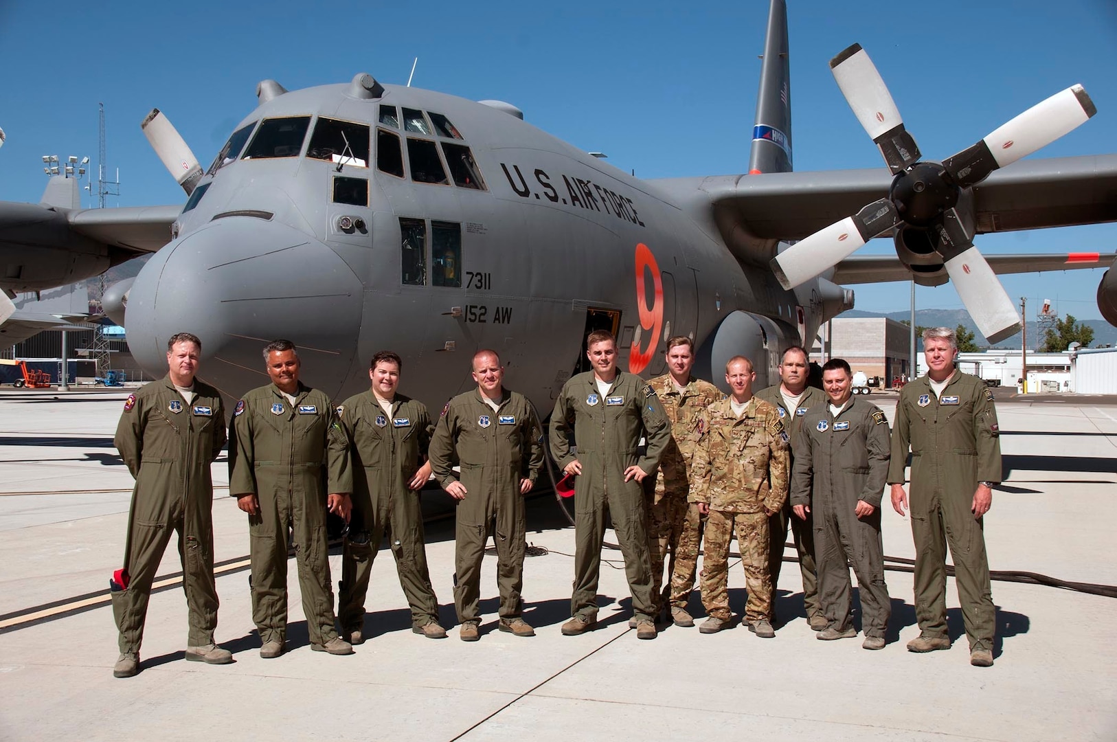 Aircrew with the 152nd Airlift Wing, Nevada Air National Guard, pose for a photo before departing Reno to assist federal firefighting agencies at Peterson Air Force Base for the Colorado fires on July 5, 2018.