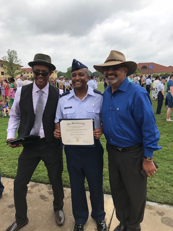 A family poses for a photo at a graduation.