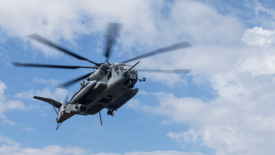 A U.S. Marine Corps CH-53E Super Stallion assigned to Marine Heavy Helicopter Squadron 464 is utilized during an external lift training exercise at Marine Corps Outlying Landing Field Atlantic, N.C., June 27, 2018. The training was conducted to enhance readiness for landing support specialists with Transportation Support Battalion 2 and HMH-464.