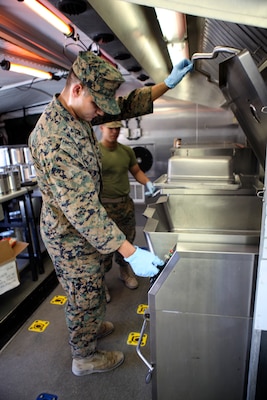 Lance Cpl. Victor Barrios, a food service Marine with Marine Wing Support Squadron 473, Marine Aircraft Group 41, 4th Marine Aircraft Wing, begins preparing food for The Major General W. P. T. Hill Memorial Awards competition for food service excellence on June 22, 2018 in Twentynine Palms, California, during Integrated Training Exercise 4-18. This competition encourages excellence in garrison and field food service. (United States Marine Corps photo by Cpl. Alexis B. Rocha/released)