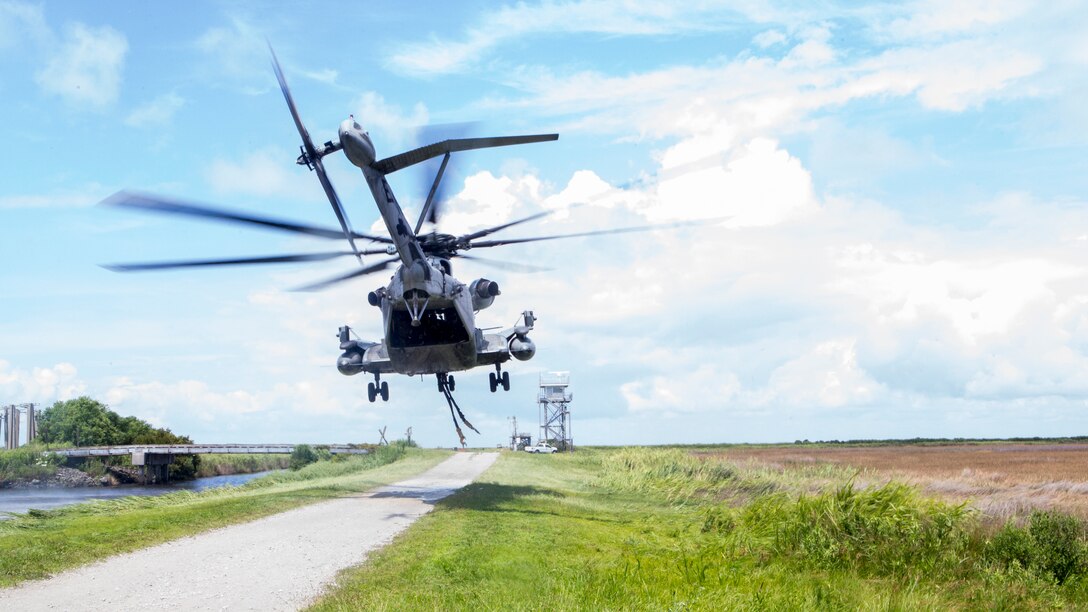 A U.S. Marine Corps CH-53E Super Stallion assigned to Marine Heavy Helicopter Squadron 464 takes off to conduct an external lift training exercise at Marine Corps Outlying Landing Field Atlantic, N.C., June 27, 2018. The training was conducted to enhance readiness for landing support specialists with TSP-2 and Marine Heavy Helicopter Squadron 464.