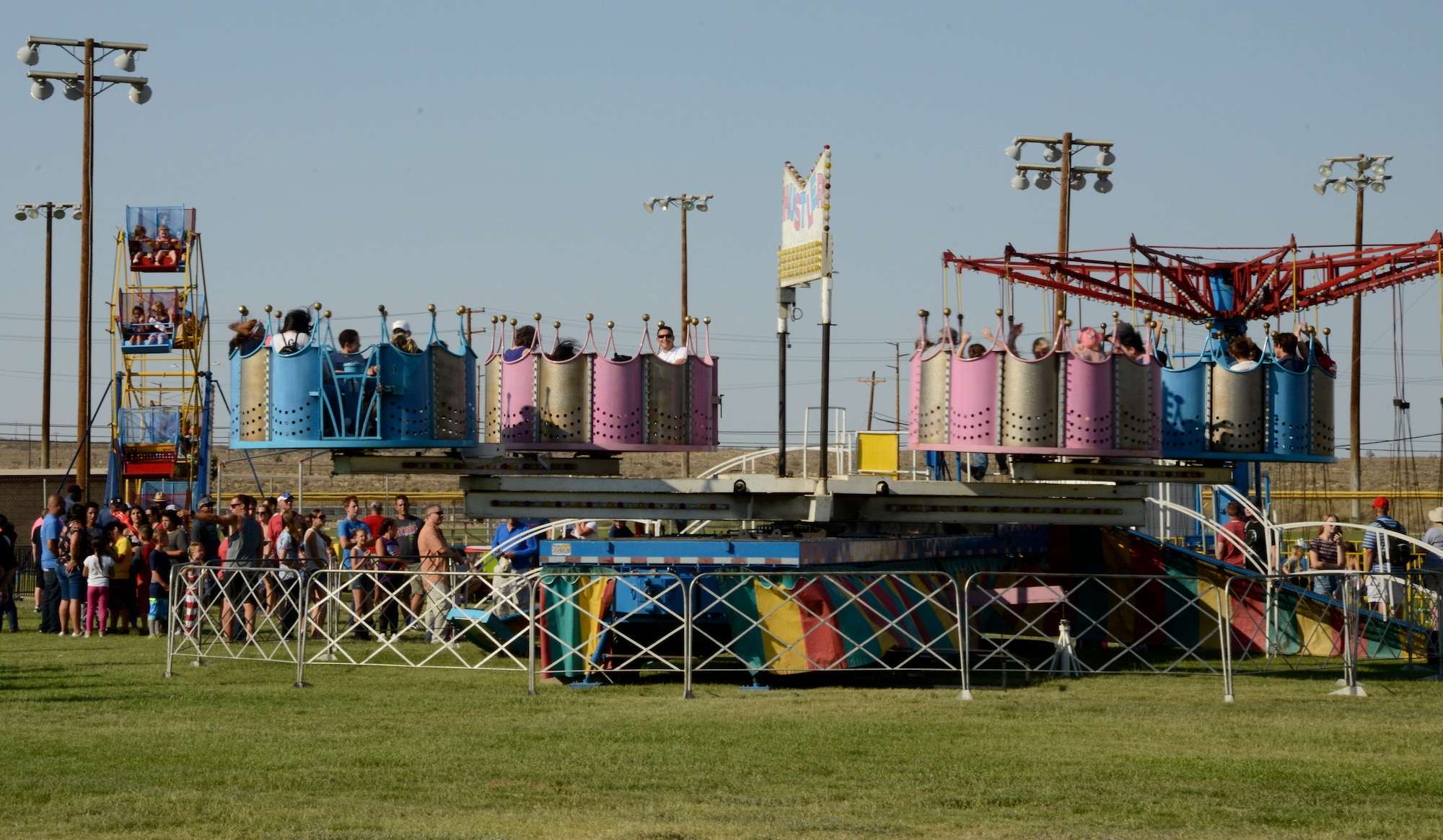 The new carnival ride, the Hustler, thrills carnival goers during the Summer Bash at Wings Field, July 4. This year's bash drew more than 2,500 people for the five-hour event. (U.S. Air Force photo by Laura Motes)