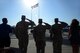Air Force Sustainment Center command staff members, from left, Andrew Williams, Staff Sgt. Bryan Lemire, Airman 1st Class George Rollins, Staff Sgt. Lindsey Otto and Vandi Leheny demonstrate correct etiquette during the daily Retreat ceremony.
