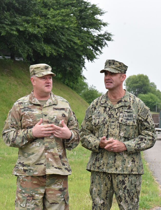 DLA Pacific Commander Navy Capt. Timothy Daniels (right) and Army Col. Brent Coryell, deputy commander (left); discuss operations during the grand opening of DLA Disposition Services’ new collection point at Camp Humphreys.