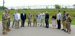 Local warfighters and Defense Logistics Agency personnel gather together at the new collection point on Camp Humphreys to celebrate its grand opening.