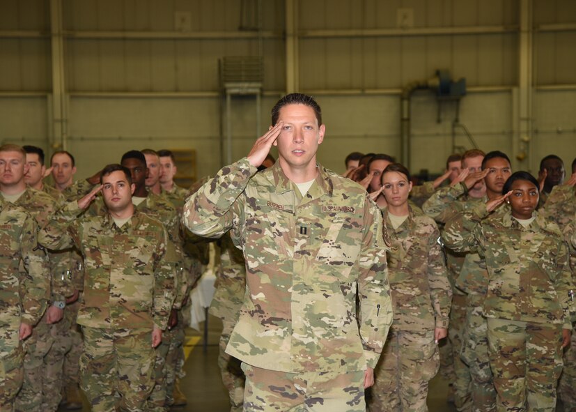 Defenders of the 90th Security Forces Squadron render a salute to Lt. Col. Nicholas Petren, their commander, at the 90th SFS Change of Command in the Peacekeeper High Bay on F.E. Warren Air Force Base, Wyo., July 6, 2018. Petren assumed command of the group during the ceremony which represents a formal transition of authority from the outgoing commanding to the incoming commander. (U.S. Air Force photo by Glenn S. Robertson)