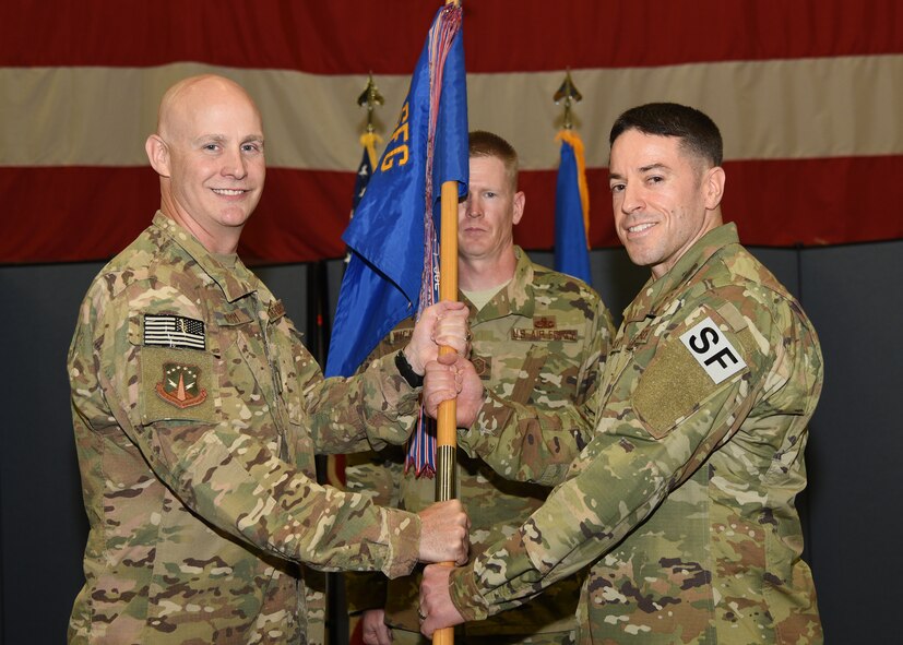 Guidon Transfer
Colonel G John Grimm, 90th Security Forces commander, passes the guidon to Col. Nicholas Petren, 90th Security Forces Squadron commander, during the 90th SFS change of command ceremony July 6, 2018 in the Peacekeeper High Bay on F.E. Warren Air Force Base, Wyo. The ceremony signified the transition of command from Lt. Col. Richard Zeigler to Petren. (U.S. Air Force photo by Glenn S. Robertson)