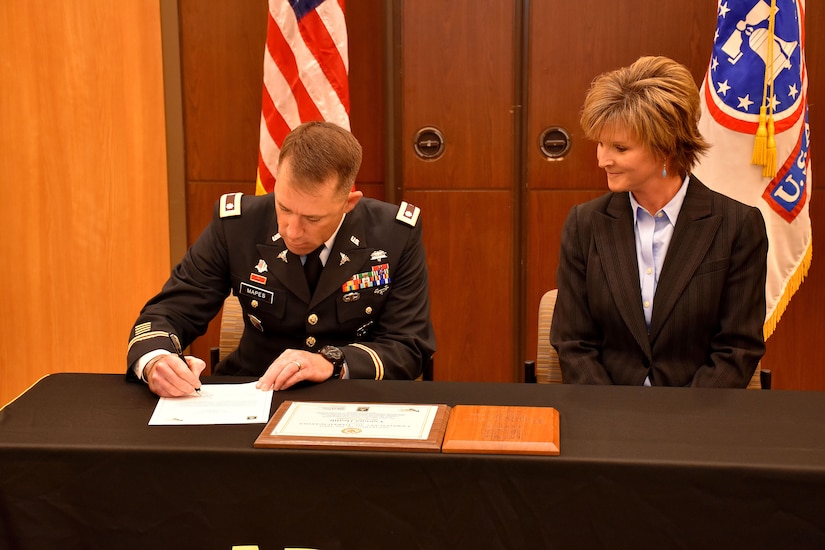 6th Medical Recruiting Battalion Commander, Lt. Col. Matthew Mapes, presents the PaYS certificate to Amy King, senior vice president and chief people manager, Centura Health, as part of ceremony to recognize the partnership at St. Anthony Hospital in Lakewood, Colo. on May 22, 2018.