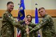 Maj. Michael Warren, right, accepts command of the 341st Security Forces Squadron from Col. Aaron Guill, 341st Security Forces Group commander, during an assumption of command ceremony July 6, 2018, at Malmstrom AFB, Mont.
