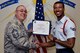 U.S. Air Force Chief Master Sgt. Daniel Stein, 17th Training Group superintendent, presents the 17th TRG Rope of the Month award to Airman 1st Class Devontee Lawson, 316th Training Squadron trainee, at Brandenburg Hall on Goodfellow Air Force Base, Texas, July 6, 2018. Military Training Leaders present ropes to Airmen who display exceptional leadership qualities to lead their peers. (U.S. Air Force photo by Senior Airman Randall Moose/Released)