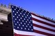 Volunteers from Goodfellow Air Force Base, Texas drape the United States flag over Chadbourne Street bridge during the 31st Annual San Angelo Symphony Pops Concert July 3, 2018. The free concert was held as an early celebration of Independence Day. (U.S. Air Force photo by Airman 1st Class Seraiah Hines/Released)