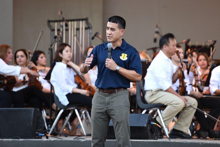U.S. Air Force Col. Ricky Mills, 17th Training Wing commander, speaks before the start of the 31st Annual San Angelo Symphony Pops Concert at the Bill Aylor Sr. Memorial RiverStage, San Angelo, Texas, July 3, 2018. Mills reflected on the relationship that Goodfellow and San Angelo share, thanking the community for their constant support. (U.S. Air Force photo by Airman 1st Class Seraiah Hines/Released)