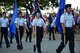 Goodfellow volunteers present the 50 state flags during the 31st Annual San Angelo Symphony Pops Concert at the Bill Aylor Sr. Memorial RiverStage, San Angelo, Texas, July, 3, 2018. Attendees of the concert were able to enjoy a variety of patriotic songs from the symphony and a firework display at sundown. (U.S. Air Force photo by Airman 1st Class Seraiah Hines/Released)