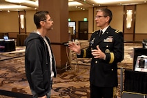 Brig. Gen. Joe Heck, Deputy Joint Staff Surgeon and Director, Reserve Readiness, speaks to an attendee of the Essentials of Emergency Medicine workshop at the Cosmopolitan Hotel in Las Vegas on 15 May. Heck was on hand with members of the 6th Medical Recruiting Battalion to explain the benefits and opportunities of a career in Army Medicine. For more information on the Army's more than 80 medical specialties, go online at healthcare.goarmy.com.