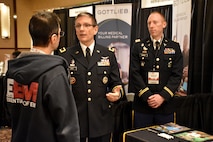Brig. Gen. Joe Heck, Deputy Joint Staff Surgeon and Director, Reserve Readiness, and Capt. Nelson Kranz, Denver Medical Recruiting Company commander, speak to an attendee of the Essentials of Emergency Medicine workshop at the Cosmopolitan Hotel in Las Vegas on 15 May. Heck and Kranz were on hand with members of the 6th Medical Recruiting Battalion to explain the benefits and opportunities of a career in Army Medicine. For more information on the Army's more than 80 medical specialties, go online at healthcare.goarmy.com.