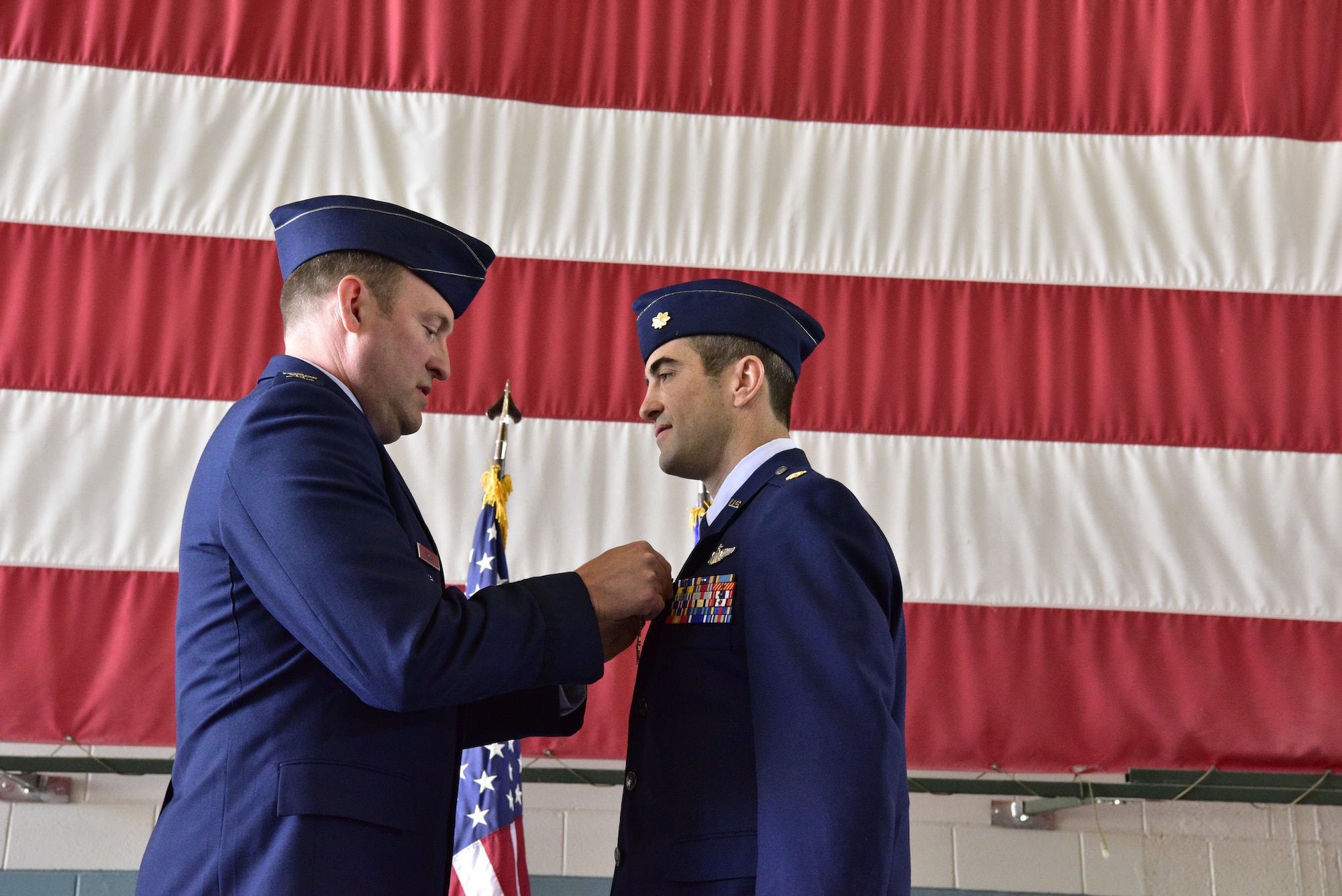 Col. Bradley Downs (left), vice commander of the 492nd Special Operations Wing, pins the Distinguished Flying Cross on Maj. Michael Tolzien, 58th Special Operations Wing during a ceremony July 6 at Kirtland Air Force Base.