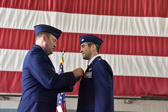 Col. Bradley Downs (left), vice commander of the 492nd Special Operations Wing, pins the Distinguished Flying Cross on Maj. Michael Tolzien, 58th Special Operations Wing during a ceremony July 6 at Kirtland Air Force Base.