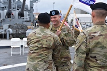 Outgoing Los Angeles Medical Recruiting Commander, Capt. Shawn Linhares receives the company guidon from 1st Sgt. Michael Susi during the Change of Command Ceremony on 11 May. The Los Angeles Medical Recruiting Company held their ceremony on the USS Iowa at the Port of Los Angeles and said farewell to Linhares while welcoming Capt. David O'hea as the incoming commander.