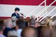 Capt. Kristi Machado, 56th Force Support Squadron sustainment services flight commander, narrates the 56th Fighter Wing change of command ceremony June 20, 2018, at Luke Air Force Base, Ariz. Machado spent the first decade of her career as an enlisted Airman in assignments with units like the U.S. Air Force Thunderbirds. (U.S. Air Force photo by Airman 1st Class Alexander Cook)