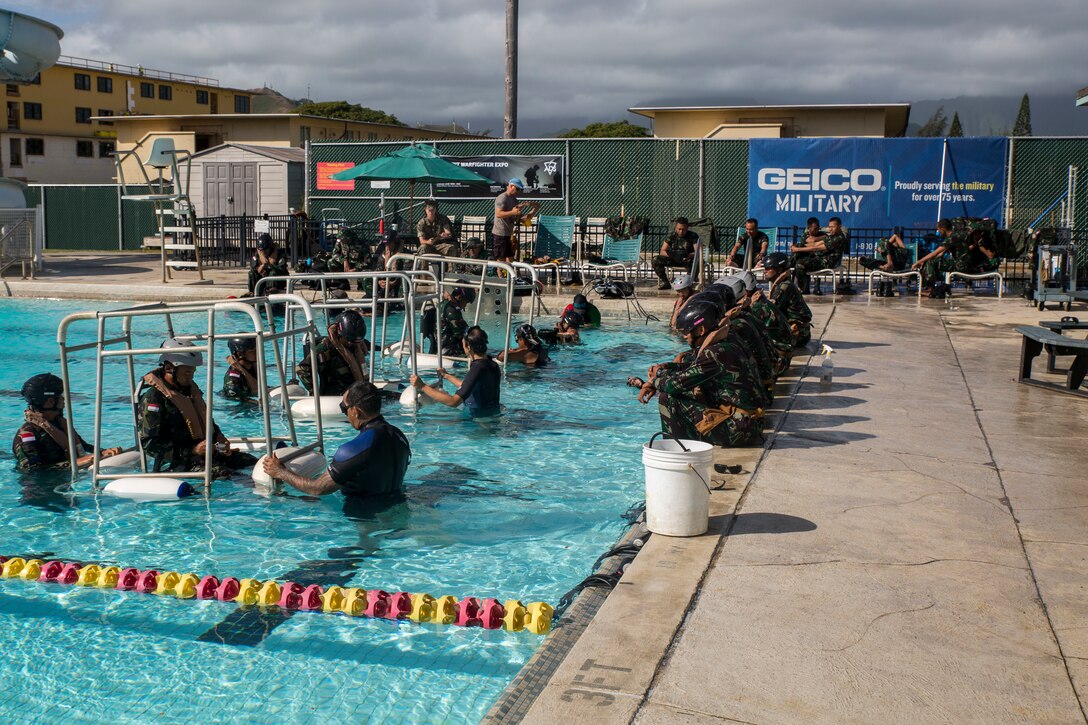 Indonesian Marines participate in shallow water egress training during Rim of the Pacific (RIMPAC) exercise at Marine Corps Base Hawaii July 5, 2018. RIMPAC provides high-value training for task-organized, highly-capable Marine Air-Ground Task Force and enhances the critical crisis response capability of U.S. Marines in the Pacific. Twenty-five nations, 46 ships, five submarines, about 200 aircraft and 25,000 personnel are participating in RIMPAC from June 27 to Aug. 2 in and around the Hawaiian Islands and Southern California. (U.S. Marine Corps photo by Lance Cpl. Adam Montera)