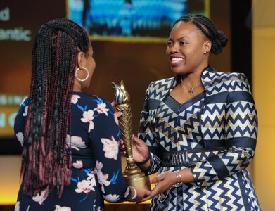 Space and Naval Warfare Systems Center Atlantic employee Sierra S. Williams receives the Professional Member of the Year Award during the National Society of Black Engineers Golden Torch Awards ceremony.