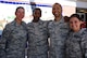 Master Sgt. Denise Hunt, the career advisor for the 932nd Aeromedical Staging Squadron, welcomes back two deployers including Senior Airman Dominique Johnson (second from left) and Staff Sgt. Kristine Cannon (far right) with assistance from Master Sgt. Tray Turner (second from right) during a special "welcome home" luncheon July 7, 2018, at Scott Air Force Base, Ill.  The USO of Missouri came out and provided pulled pork as part of the lunch along with a cake.  (U.S. Air Force photo by Lt. Col. Stan Paregien)