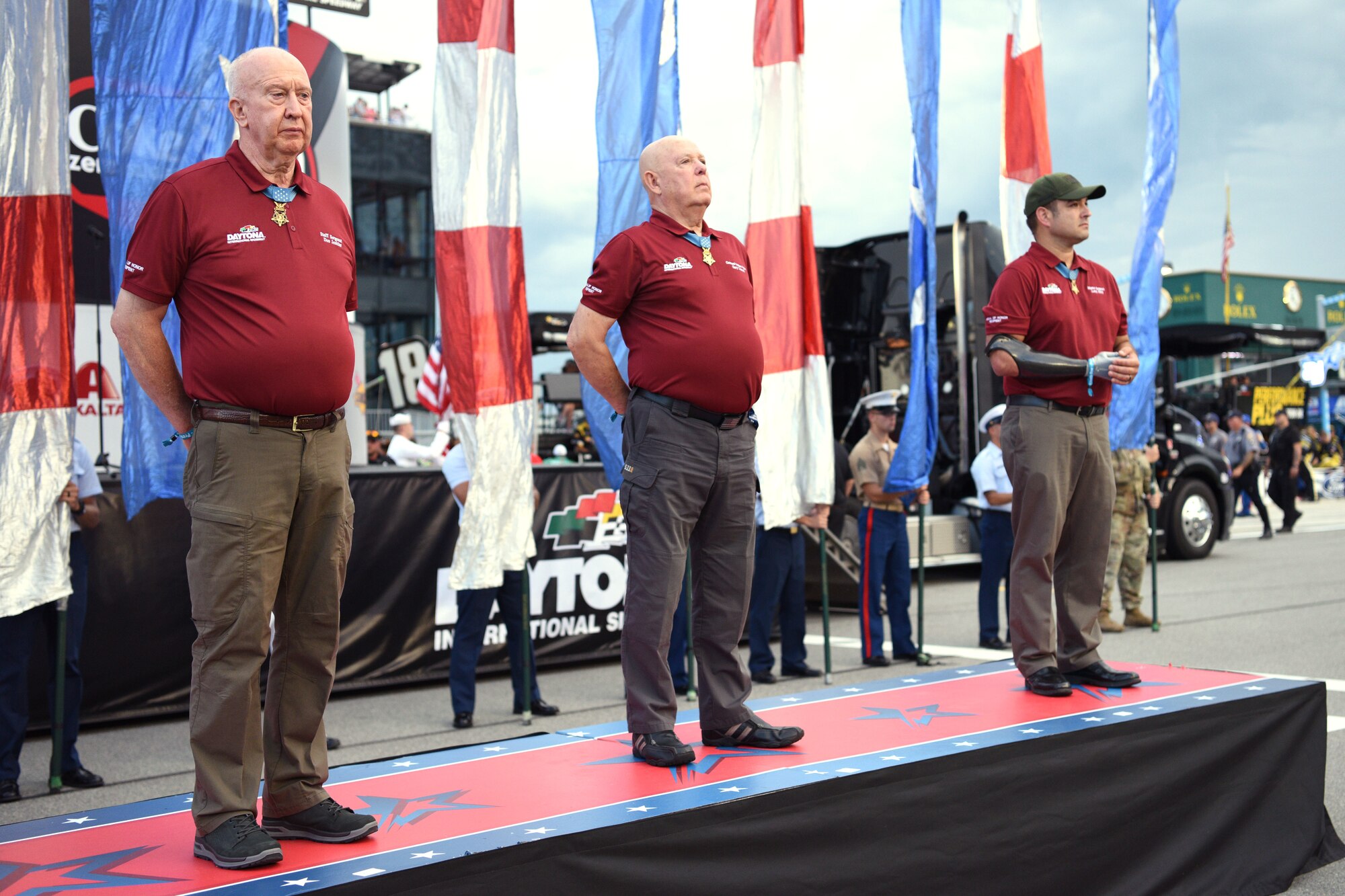 (From left) Medal of Honor recipients Staff Sgt. Dan Jenkins,  Command Sgt. Maj. Gary Littrell and Master Sgt. Leroy Petry, all U.S. Army veterans, are honored during a pre-race ceremony July 7, at the Daytona International Speedway in Daytona Beach, Fla. Jenkins and Littrell are Vietnam veterans and Petry is an Operation Iraqi Freedom veteran. (U.S. Air Force photo by Airman 1st Class Zoe Thacker)