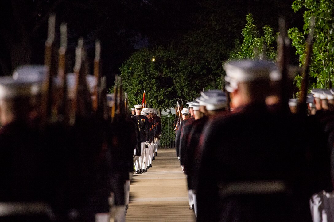 Marines with Alpha and Bravo Companies, Marine Barracks Washington D.C., march onto the parade deck during a Friday Evening Parade at the Barracks, July 6, 2018. The guests of honor for the parade were His Excellency Ambassador Virachai Plasai, ambassador of the Kingdom of Thailand to the U.S., and Minister Patrick A. Chuasoto, deputy chief of Mission, Embassy of the Republic of the Philippines to the U.S. The hosting official for the parade was Lt. Gen. Steven R. Rudder, deputy commandant of Aviation. (Official Marine Corps photo by Sgt. Robert Knapp/Released)