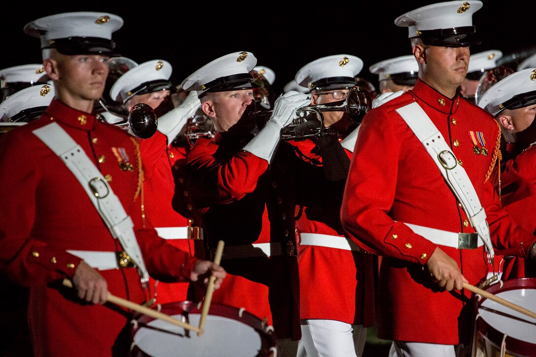 Marines with “The Commandant’s Own,” U.S. Marine Drum & Bugle Corps, perform a musical ballad during a Friday Evening Parade at Marine Barracks Washington D.C., July 6, 2018. The guests of honor for the parade were His Excellency Ambassador Virachai Plasai, ambassador of the Kingdom of Thailand to the U.S., and Minister Patrick A. Chuasoto, deputy chief of Mission, Embassy of the Republic of the Philippines to the U.S. The hosting official for the parade was Lt. Gen. Steven R. Rudder, deputy commandant of Aviation. (Official Marine Corps photo by Sgt. Robert Knapp/Released)