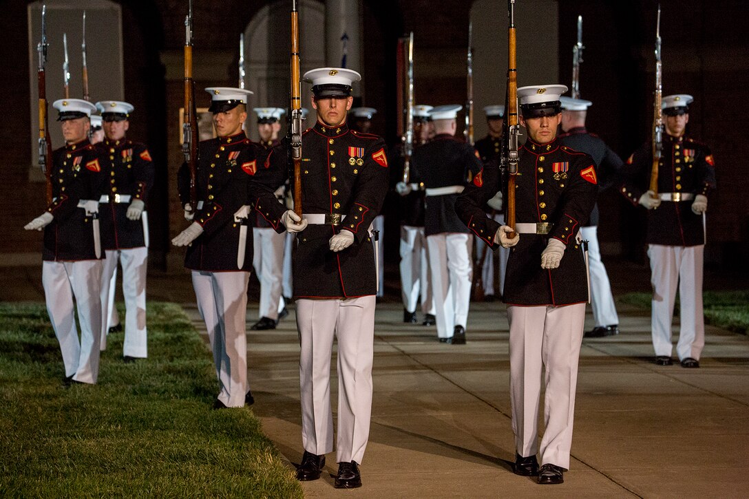 Marines with the U.S. Marine Corps Silent Drill Platoon execute a “steep right” during a Friday Evening Parade at Marine Barracks Washington D.C., July 6, 2018. The guests of honor for the parade were His Excellency Ambassador Virachai Plasai, ambassador of the Kingdom of Thailand to the U.S., and Minister Patrick A. Chuasoto, deputy chief of Mission, Embassy of the Republic of the Philippines to the U.S. The hosting official of the parade was Lt. Gen. Steven R. Rudder, deputy commandant of Aviation. (Official Marine Corps photo by Sgt. Robert Knapp/Released)