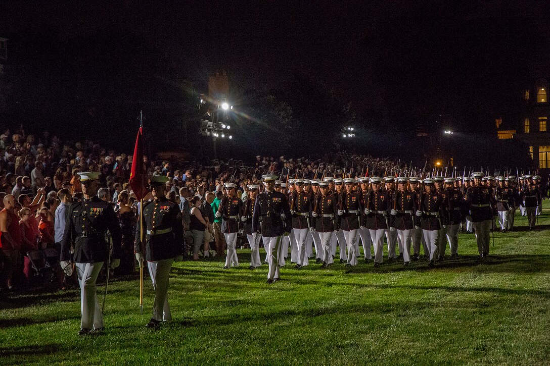 Marines with Alpha and Bravo Companies, Marine Barracks Washington D.C., march across the parade deck during a Friday Evening Parade at the Barracks, July 6, 2018. The guests of honor for the parade were His Excellency Ambassador Virachai Plasai, ambassador of the Kingdom of Thailand to the U.S., and Minister Patrick A. Chuasoto, deputy chief of Mission, Embassy of the Republic of the Philippines to the U.S. The hosting official for the parade was Lt. Gen. Steven R. Rudder, deputy commandant of Aviation. (Official Marine Corps photo by Sgt. Robert Knapp/Released)