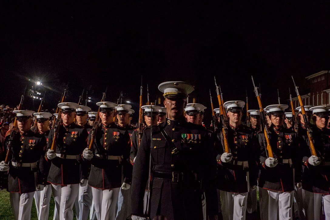 Marines with 3rd platoon, Bravo Company, Marine Barracks Washington D.C., march across the parade deck during a Friday Evening Parade at the Barracks, July 6, 2018. The guests of honor for the parade were His Excellency Ambassador Virachai Plasai, ambassador of the Kingdom of Thailand to the U.S., and Minister Patrick A. Chuasoto, deputy chief of Mission, Embassy of the Republic of the Philippines to the U.S. The hosting official for the parade was Lt. Gen. Steven R. Rudder, deputy commandant of Aviation. (Official Marine Corps photo by Sgt. Robert Knapp/Released)
