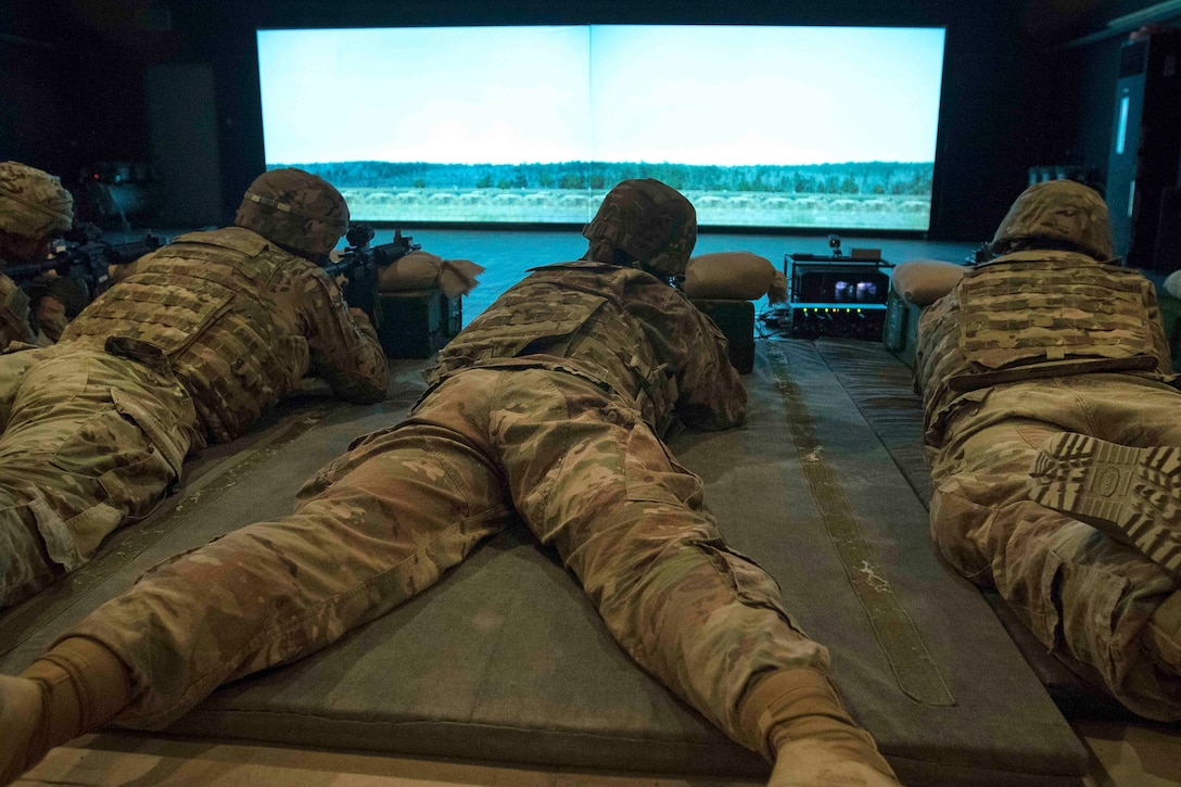 Soldiers use an Engagement Skills Trainer.