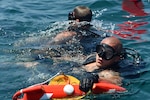 Explosive Ordnance Disposal (EOD) Technician 2nd Class Matt Strong (right) and EOD Technician 3rd Class Joe Krzemien return to the boat following a dive during exercise Resolute Response (RR) 18. RR18 is a bilateral EOD, diving and visit, board, search and seizure engagement with the U.S. and Lebanese Armed Forces to enhance military-to-military cooperation and counter maritime threats (U.S. Navy photo by Mass Communication Specialist 1st Class Bryan Neal Blair/Released)