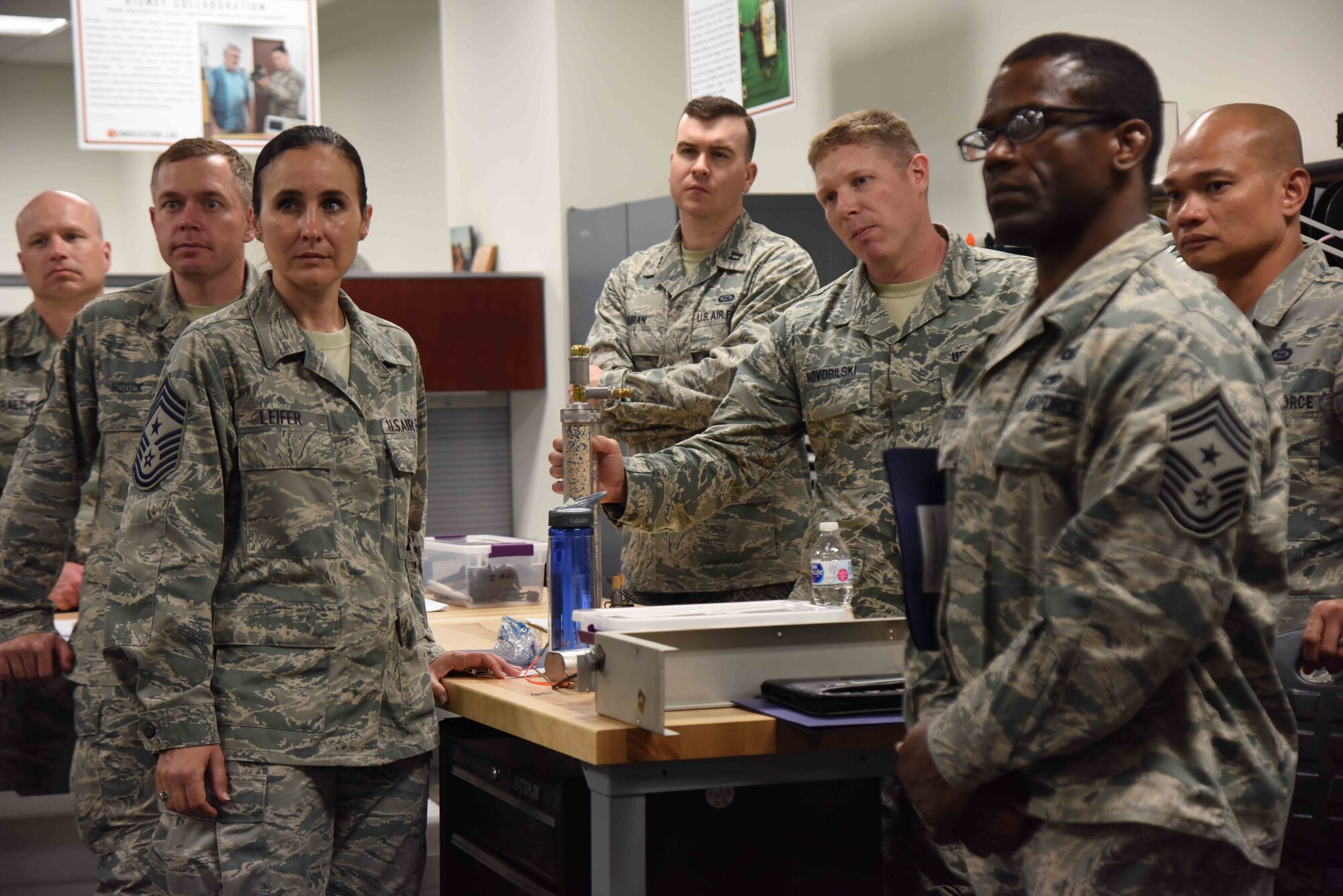 Leaders from across 25th Air Force's Intelligence, Surveillance and Reconnaissance community listen as members of the Air Force Technical Applications Center brief them on how the center uses innovation to develop and streamline technologies and processes at a cheaper cost while simultaneously addressing mission gaps.  Thirty-five ISR Airmen visited the nuclear treaty monitoring center June 1, 2018.  (U.S. Air Force photo by Susan A. Romano)