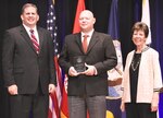 IMAGE:  WASHINGTON (Jun. 29, 2018) - James F. Geurts, Assistant Secretary of the Navy for Research, Development & Acquisition (ASN (RD&A)), joins Dr. Delores M. Etter, former (ASN (RD&A)) and current professor emeritus, Southern Methodist University, as they present the 2017 Dr. Delores M. Etter Top Scientists and Engineers Award for Individual Engineers to Dr. Tony Buhr, Naval Surface Warfare Center Dahlgren Division, during a ceremony at the Pentagon. (U.S. Navy photo by John F. Williams/Released)