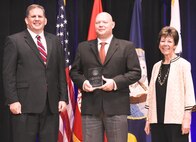 IMAGE:  WASHINGTON (Jun. 29, 2018) - James F. Geurts, Assistant Secretary of the Navy for Research, Development & Acquisition (ASN (RD&A)), joins Dr. Delores M. Etter, former (ASN (RD&A)) and current professor emeritus, Southern Methodist University, as they present the 2017 Dr. Delores M. Etter Top Scientists and Engineers Award for Individual Engineers to Dr. Tony Buhr, Naval Surface Warfare Center Dahlgren Division, during a ceremony at the Pentagon. (U.S. Navy photo by John F. Williams/Released)