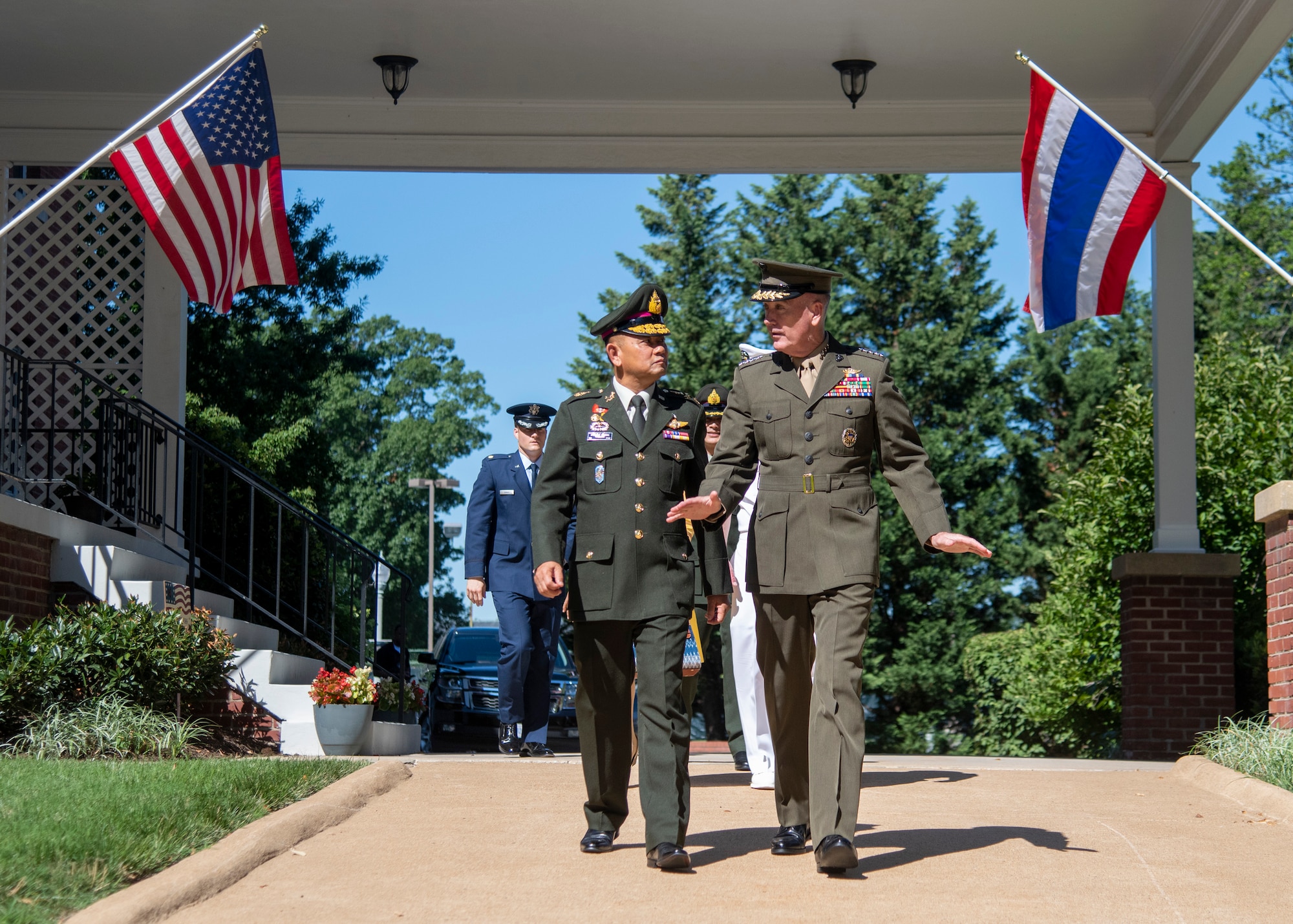 Marine Corps Gen. Joe Dunford, chairman of the Joint Chiefs of Staff, and Thai Army Gen. Tarnchaiyan Srisuwan, chief of the Defense Force, walk out to Whipple Field for an honors ceremony on Fort Myer, July 9, 2018.
