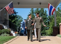 Marine Corps Gen. Joe Dunford, chairman of the Joint Chiefs of Staff, and Thai Army Gen. Tarnchaiyan Srisuwan, chief of the Defense Force, walk out to Whipple Field for an honors ceremony on Fort Myer, July 9, 2018.