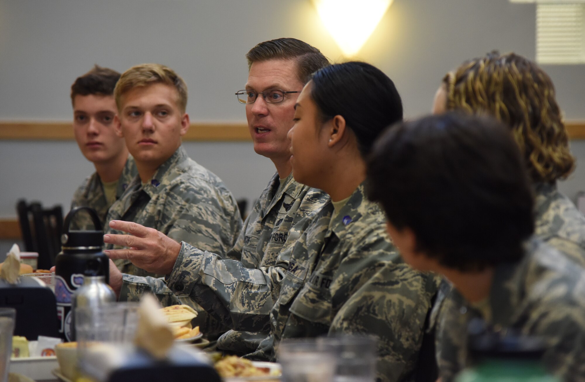 U.S. Air Force Col. C. Mike Smith, 81st Training Wing vice commander, provides comments to ROTC cadets during a mentorship luncheon in the Azalea Dining Facility at Keesler Air Force Base, Mississippi, July 9, 2018. Cadets from various college and university ROTC programs attended a two-and-a-half-week professional development training course during their stay at Keesler. (U.S. Air Force photo by Kemberly Groue)