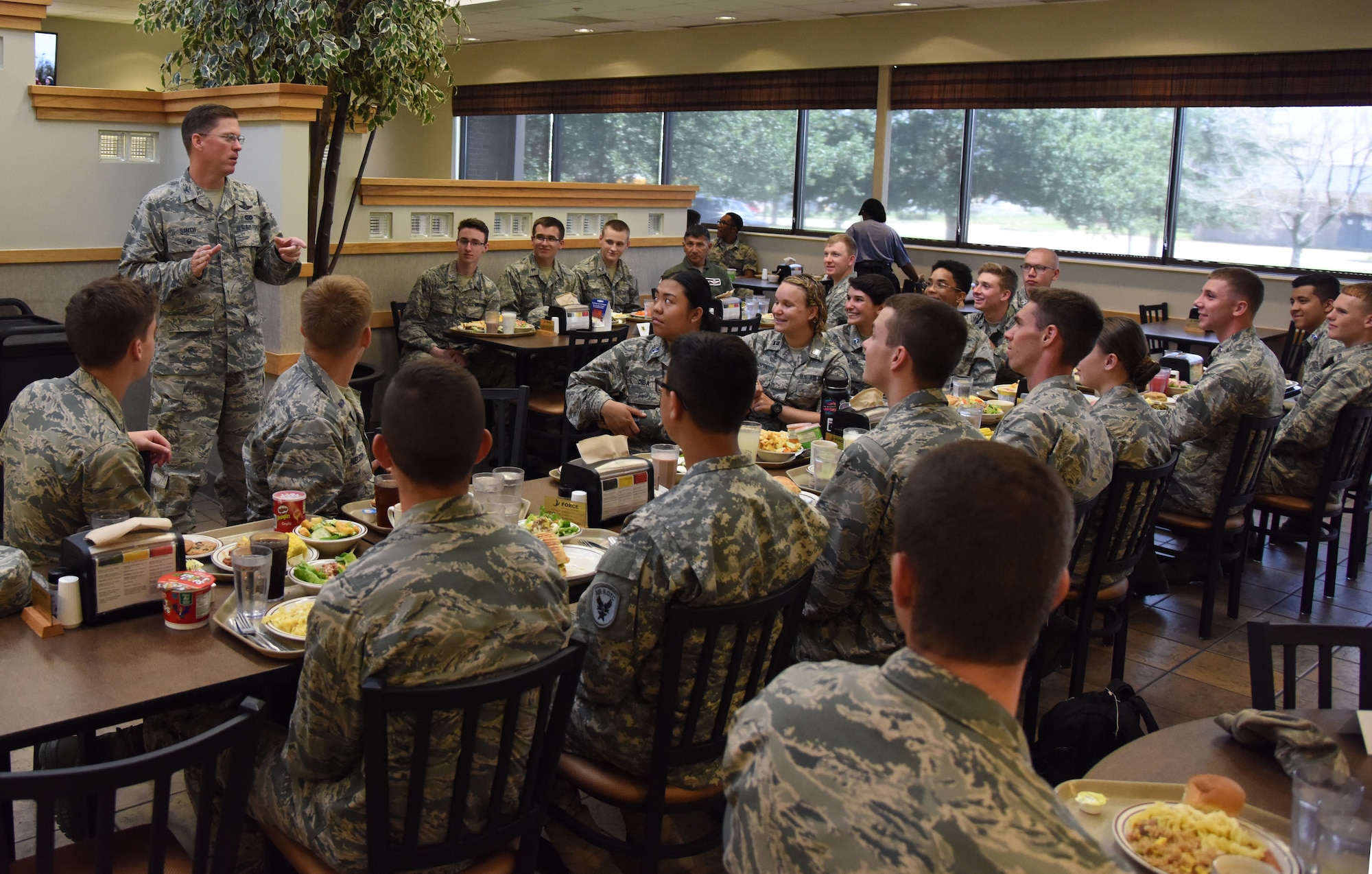 U.S. Air Force Col. C. Mike Smith, 81st Training Wing vice commander, provides comments to ROTC cadets during a mentorship luncheon in the Azalea Dining Facility at Keesler Air Force Base, Mississippi, July 9, 2018. Cadets from various college and university ROTC programs attended a two-and-a-half-week professional development training course during their stay at Keesler. (U.S. Air Force photo by Kemberly Groue)