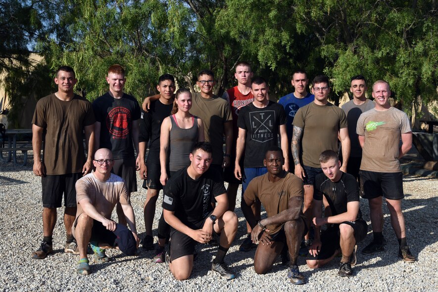 A group of 344th Military Intelligence Battalion soldiers pose for a photo after the during the 344th MI BN mud run at the Camp Sentinel training area on Goodfellow Air Force Base, Texas, July 7, 2018. This was an Army exclusive event that the 344th MI BN used as a test run before opening it up to a larger audience at a later time. (U.S. Air Force photo by Staff Sgt. Joshua Edwards/Released)