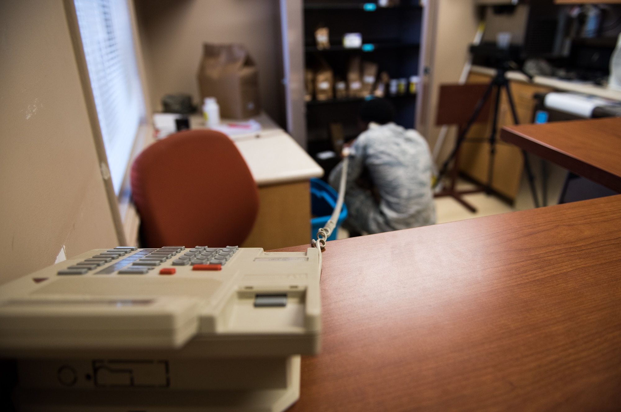 Senior Airman Cole Broomfield, 56th Medical Squadron pharmacy technician, searches through an inventory of medicine while speaking with a patient on the phone July 2, 2018 at the Luke Air Force Base Pharmacy Annex in Scottsdale, Ariz. On Monday’s and Thursday’s of every week, Broomfield provides customer service to more than 100 military ID cardholders (active duty, reserve, retirees and their families). (U.S. Air Force photo by Airman 1st Class Alexander Cook)