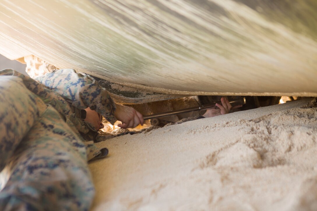 A U.S. Marine Corps combat engineer does final checks on an Amphibious Assault Vehicle assigned to Combat Assault Company prior to splash training at Pyramid Rock Beach as part of Rim of the Pacific (RIMPAC) exercise on Marine Corps Base Hawaii July 8, 2018. RIMPAC provides high-value training for task-organized, highly capable Marine-Air Ground Task Force and enhances the critical crisis response capability of U.S. Marines in the Pacific. Twenty-five nations, 46 ships, five submarines, about 200 aircraft, and 25,000 personnel are participating in RIMPAC from June 27 to Aug. 2 in and around the Hawaiian Islands and Southern California.