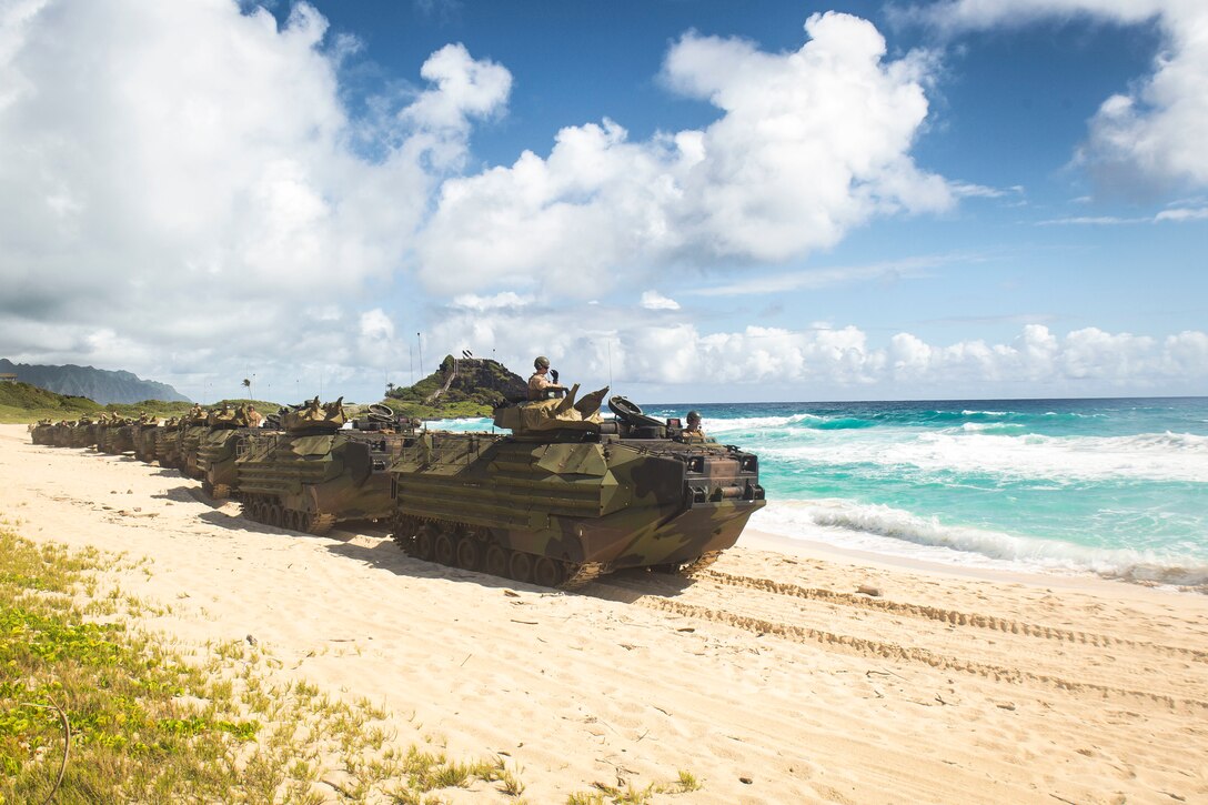 U.S. Marines with Combat Assault Company, 3rd Marine Regiment, stage AAV-P7/A1 assault amphibious vehicles for splash training at Pyramid Rock Beach as part of Rim of the Pacific (RIMPAC) exercise on Marine Corps Base Hawaii July 8, 2018. RIMPAC provides high-value training for task-organized, highly capable Marine-Air Ground Task Force and enhances the critical crisis response capability of U.S. Marines in the Pacific. Twenty-five nations, 46 ships, five submarines, about 200 aircraft, and 25,000 personnel are participating in RIMPAC from June 27 to Aug. 2 in and around the Hawaiian Islands and Southern California.