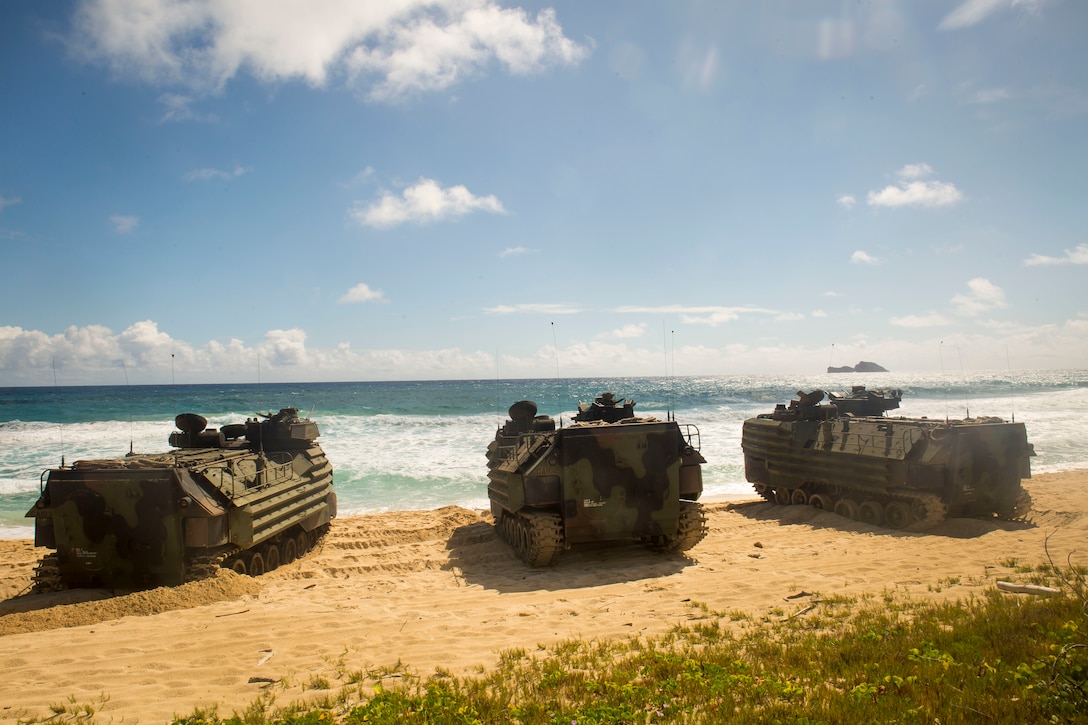 U.S. Marines with Combat Assault Company, 3rd Marine Regiment, in AAV-P7/A1 assault amphibious vehicles are staged in formation prior to splash training at Pyramid Rock Beach as part of Rim of the Pacific (RIMPAC) exercise on Marine Corps Base Hawaii July 8, 2018. RIMPAC provides high-value training for task-organized, highly capable Marine-Air Ground Task Force and enhances the critical crisis response capability of U.S. Marines in the Pacific. Twenty-five nations, 46 ships, five submarines, about 200 aircraft, and 25,000 personnel are participating in RIMPAC from June 27 to Aug. 2 in and around the Hawaiian Islands and Southern California.