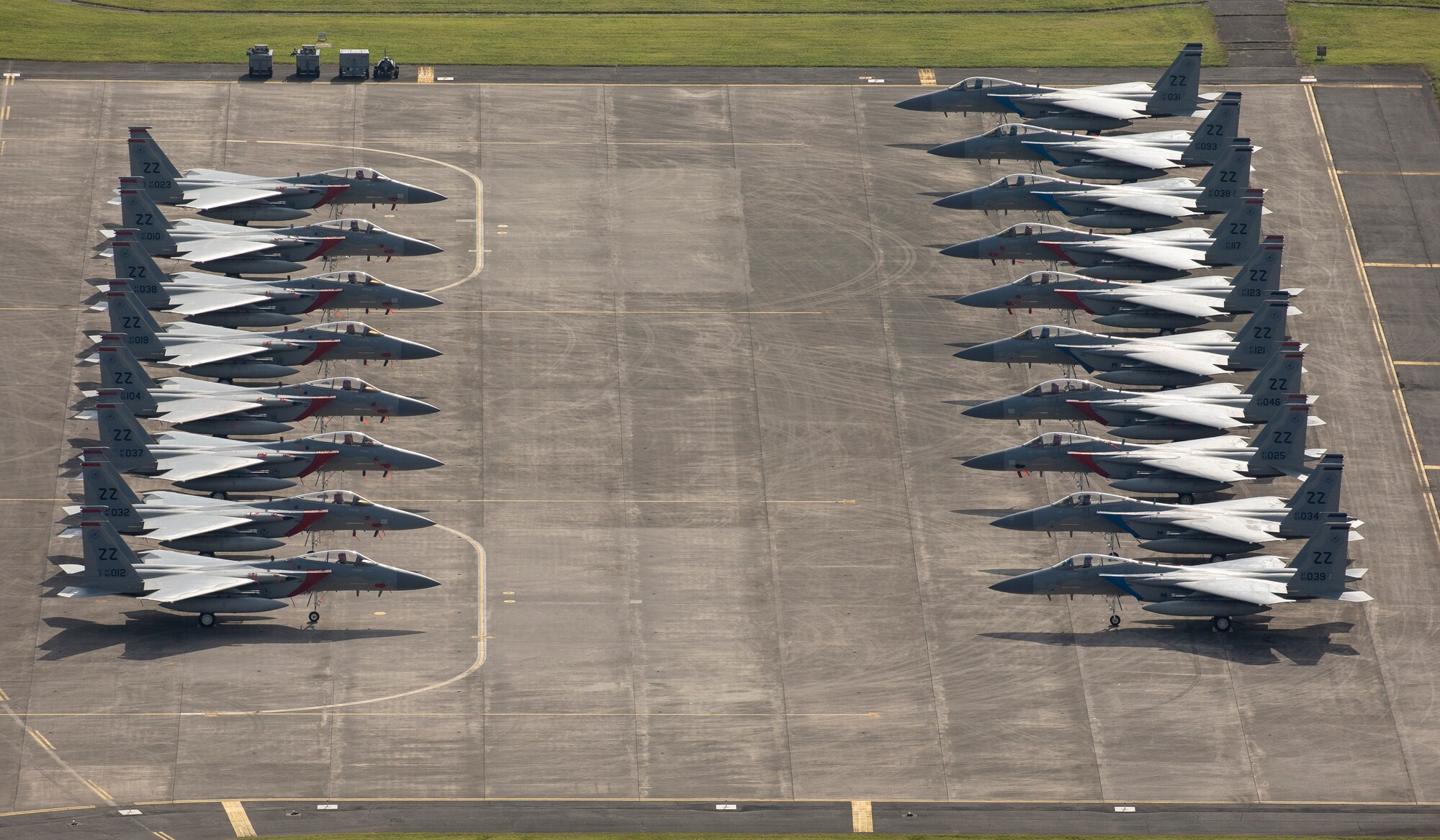 Eighteen U.S. Air Froce F-15 Eagles from Kadena Air Base are parked on the ramp, July 9, 2018