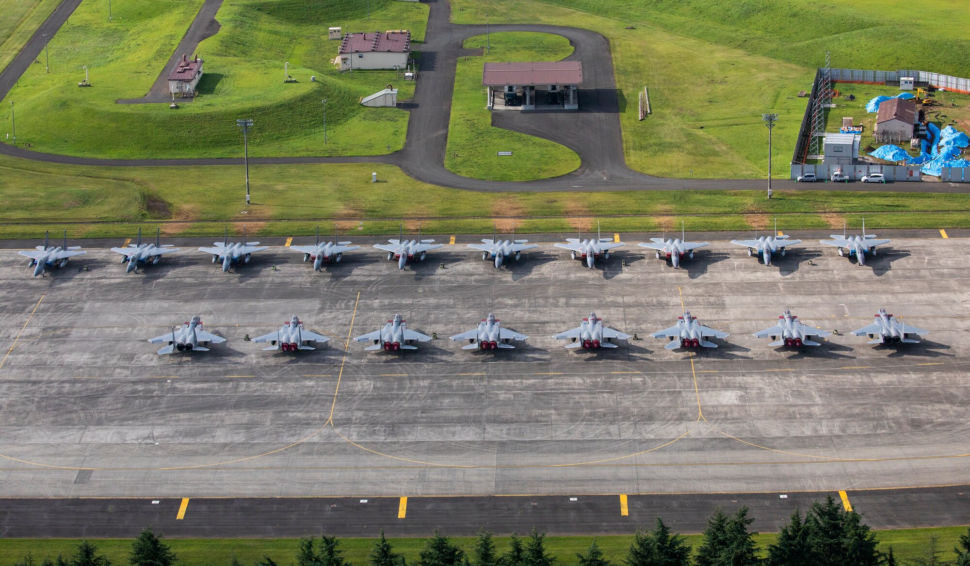 Eighteen U.S. Air Force F-15 Eagles from Kadena Air Base are parked on the ramp, July 9, 2018, at Yokota Air Base, Japan.