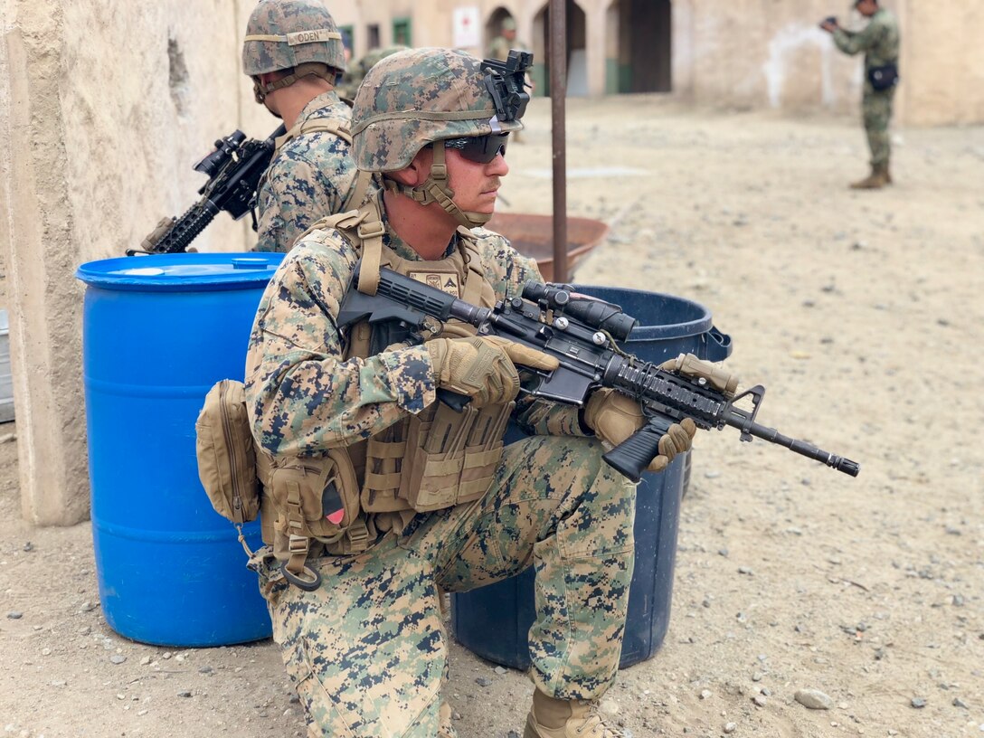 U.S. Marines with 2nd Battalion, 1st Marine Regiment and Mexican marines assigned to the Amphibious Marine Infantry Brigade stand security during an integrated squad exercise with as they navigate the infantry immersion trainer (IIT) during Rim of the Pacific (RIMPAC) exercise at Marine Corps Base Camp Pendleton, California, July 9, 2018. The IIT provided the Marines with “hands on” practical application of tactical skills and decision making in an immersive, scenario-based training environment. RIMPAC demonstrates the value of amphibious forces and provides high-value training for task-organized, highly-capable Marine Air-Ground Task Forces enhancing the critical crisis response capability of U.S. forces and partners globally. Twenty-five nations, 46 ships, five submarines, about 200 aircraft and 25,000 personnel are participating in RIMPAC from June 27 to Aug. 2 in and around the Hawaiian Islands and Southern California.