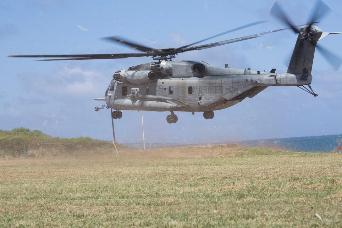 A U.S. Marine Corps CH-53E Super Stallion with Marine Heavy Helicopter Squadron 463, Marine Aircraft Group 24, 1st Marine Aircraft Wing, prepares to land during an air-assault rehearsal as part of Rim of the Pacific (RIMPAC) exercise on Marine Corps Base Hawaii July 6, 2018. RIMPAC provides high-value training for task-organized, highly-capable Marine Air-Ground Task Force and enhances the critical crisis response capability of U.S. Marines in the Pacific. Twenty-five nations, 46 ships, five submarines, about 200 aircraft and 25,000 personnel are participating in RIMPAC from June 27 to Aug. 2 in and around the Hawaiian Islands and Southern California.